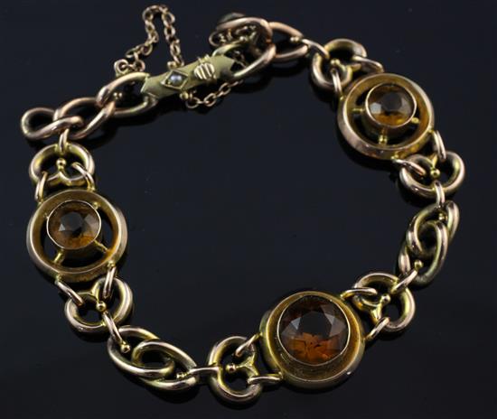 An Edwardian 9ct gold and citrine bracelet, gross 14 grams.